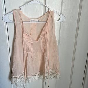 Light pink sleeveless blouse